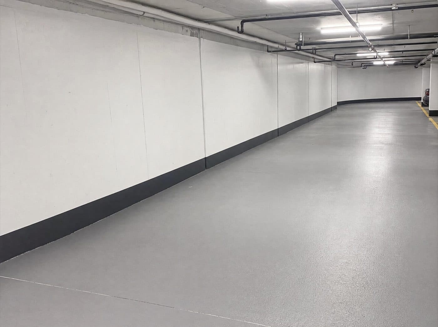Dry commercial garage wall after waterproofing membrane and joint sealing