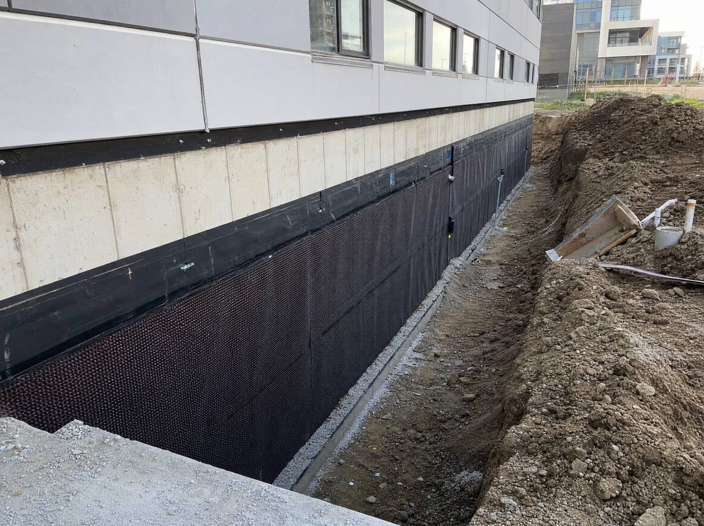 Exterior commercial foundation waterproofing excavation in Mississauga