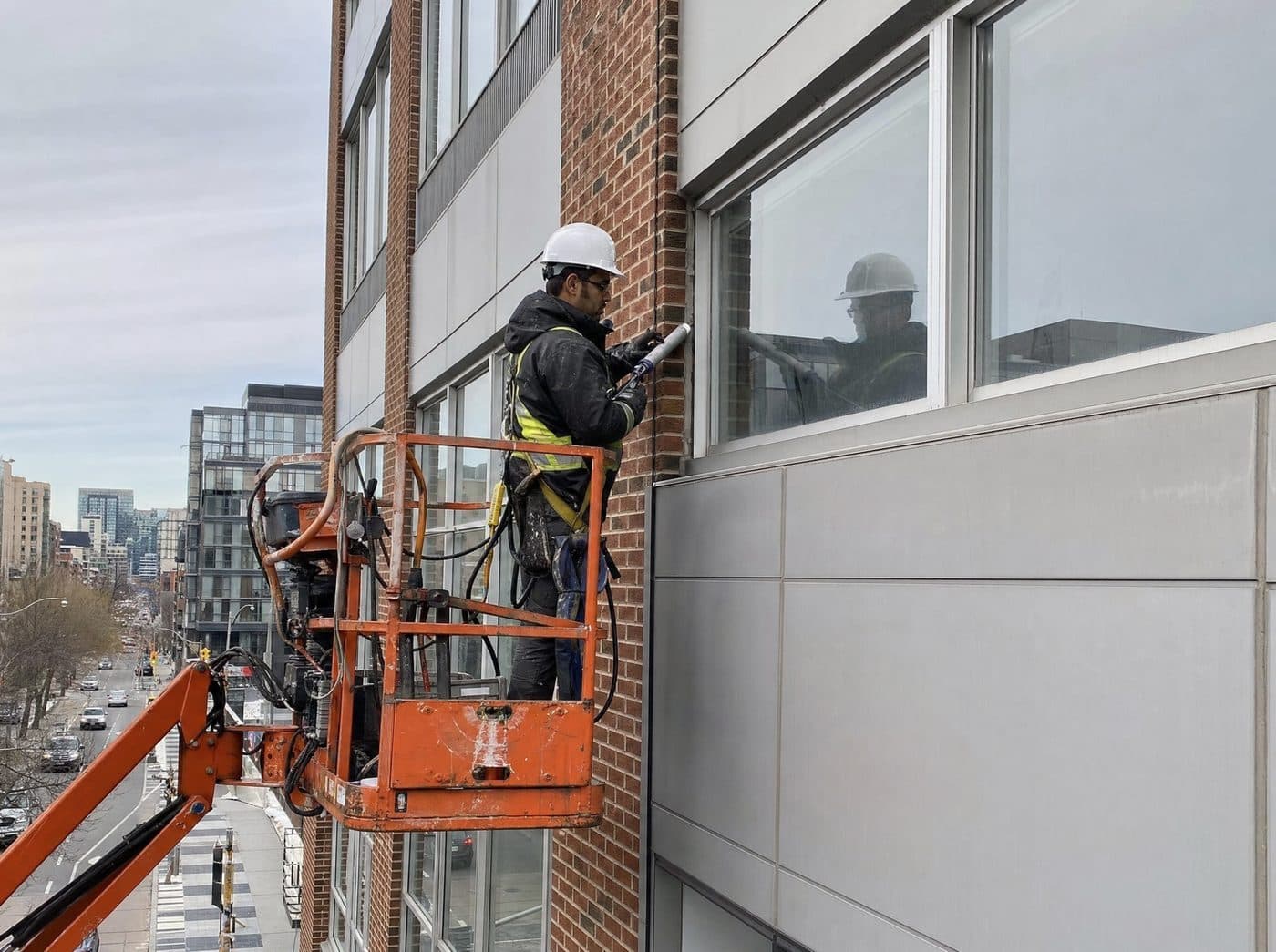 Building envelope caulking and sealant replacement on a mid-rise commercial facade